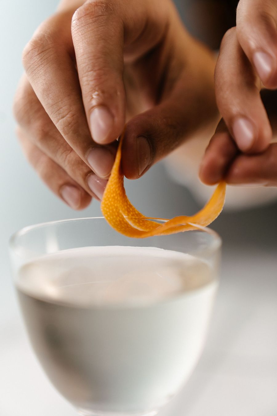 Orange peel twisted over a creamy mocktail
