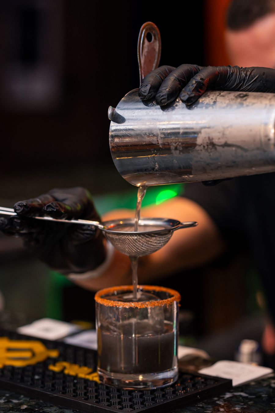 Mocktail fine-strained from a shaker into a rimmed glass